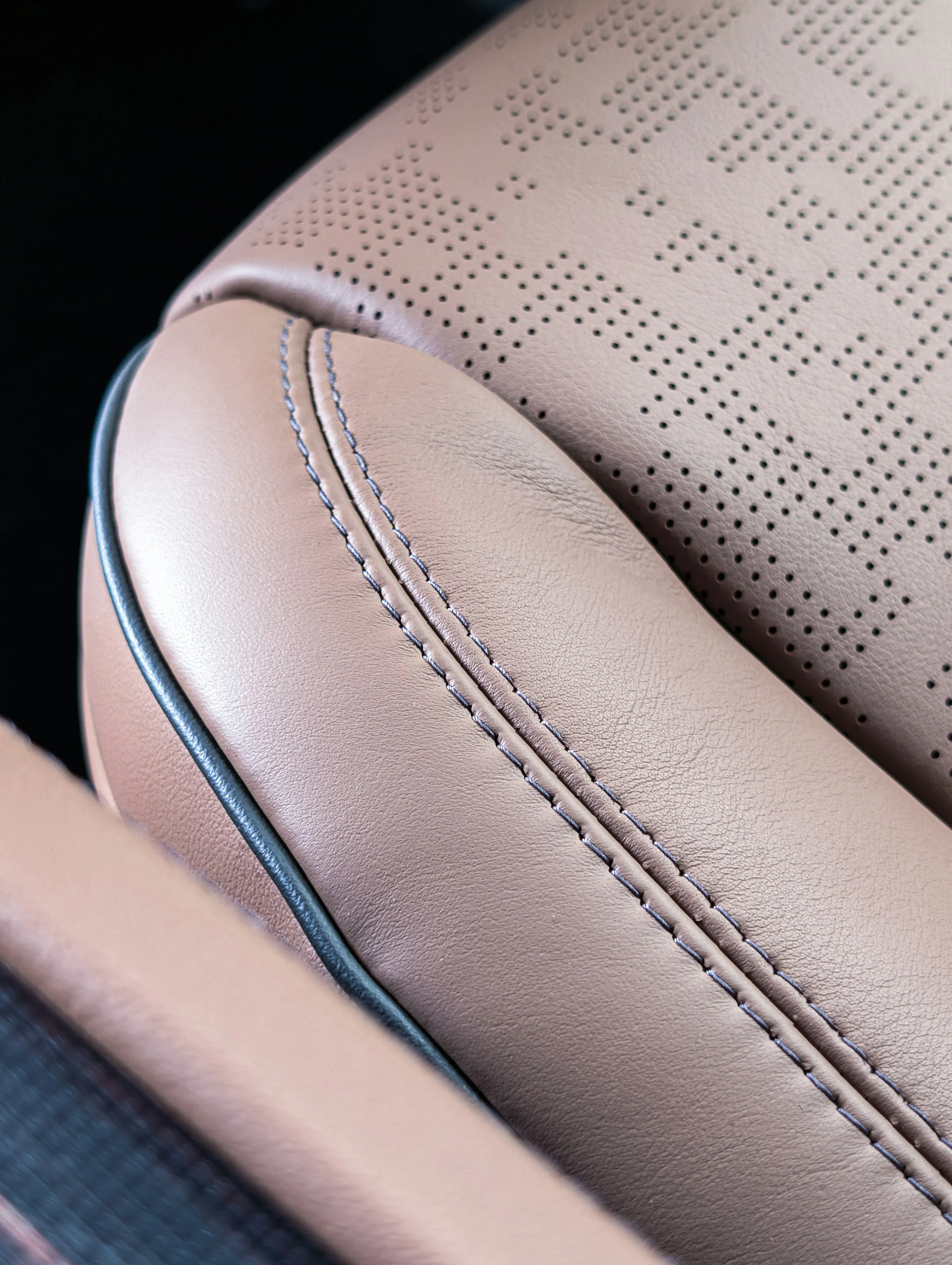 Perforated leather with contrast stitching